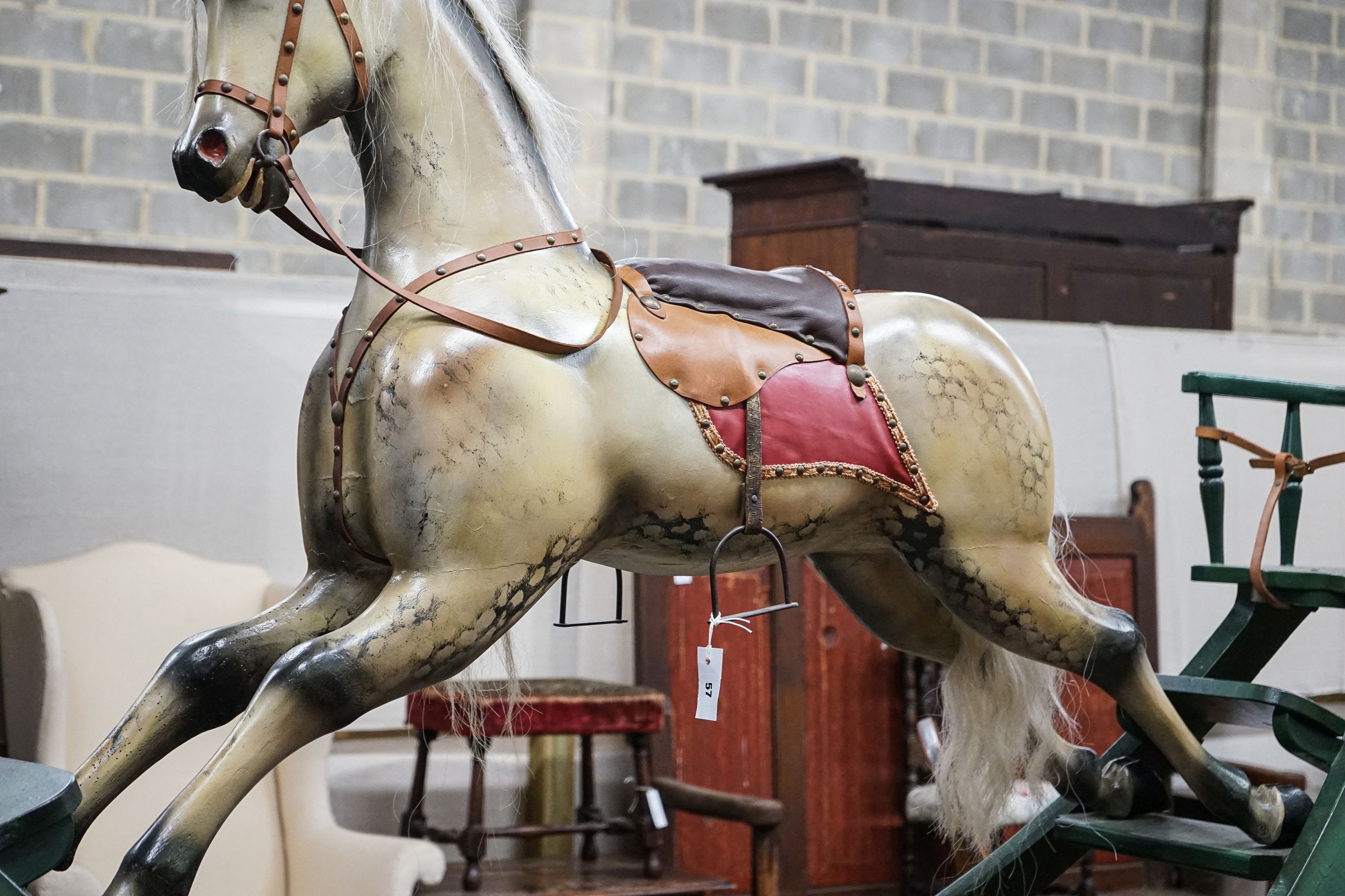 A large Victorian style painted rocking horse with end seats, length 240cm, height 132cm